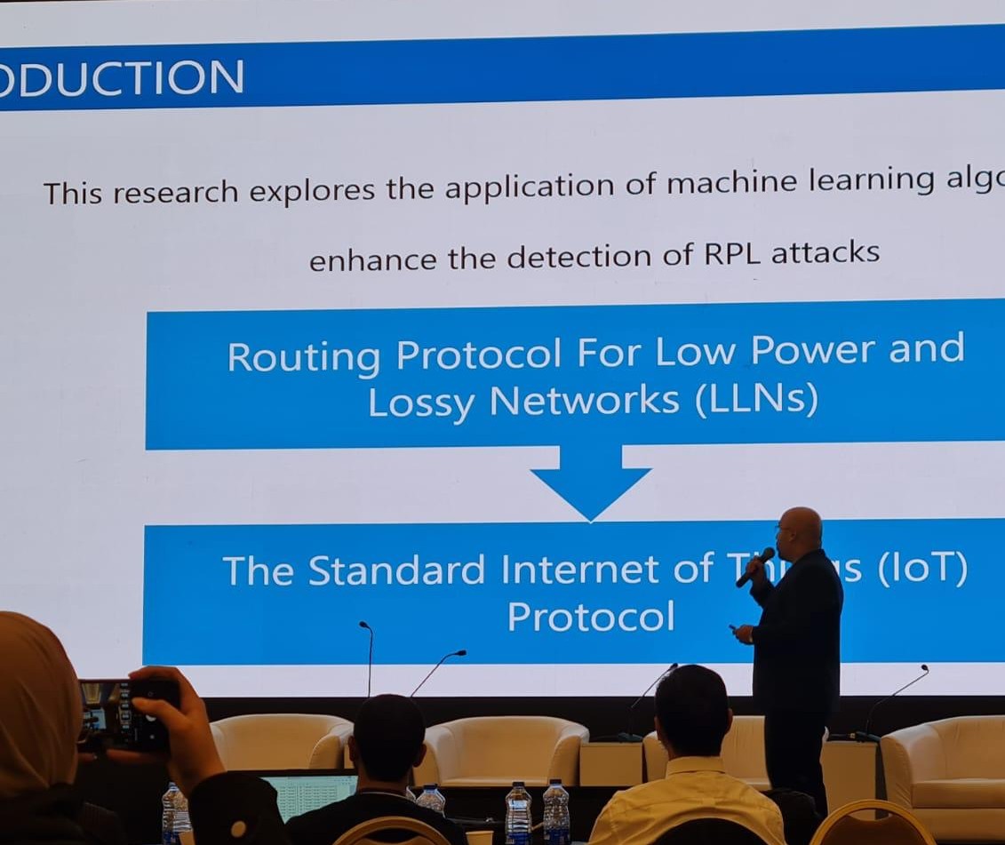 CyberHubJo members presenting research at a conference booth